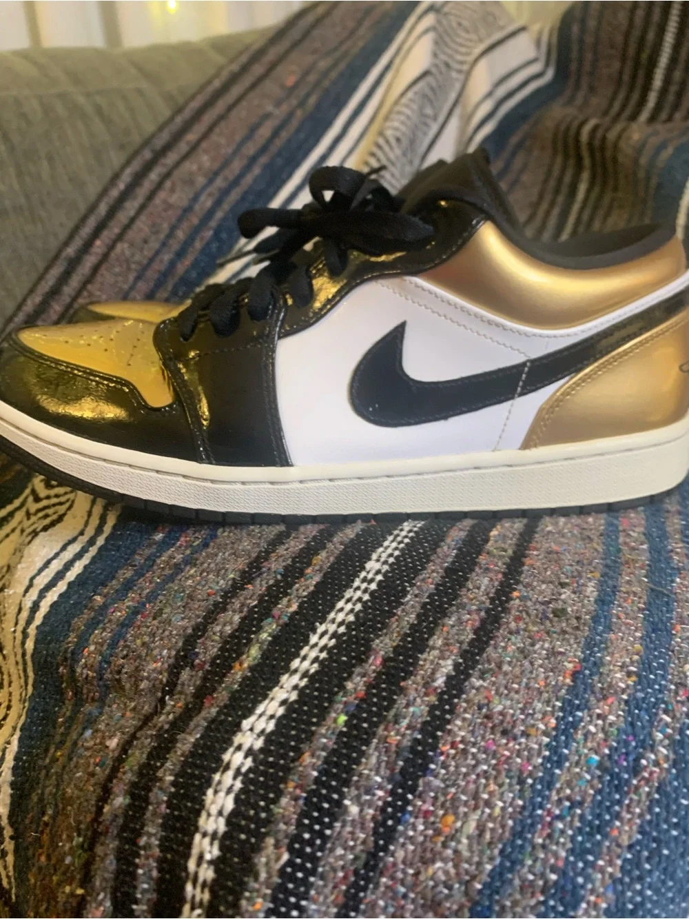 Air Jordan low “Gold Toe” in size 11 men.